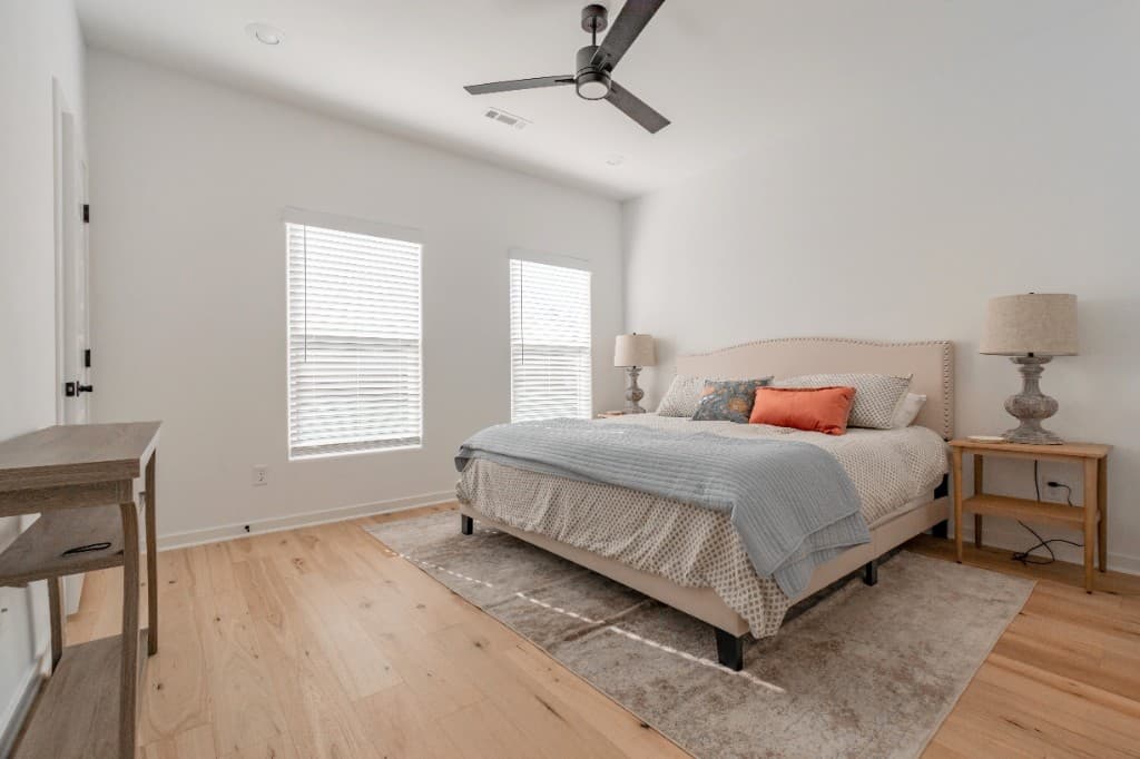 Deans Row Avenue — bedroom with upholstered headboard