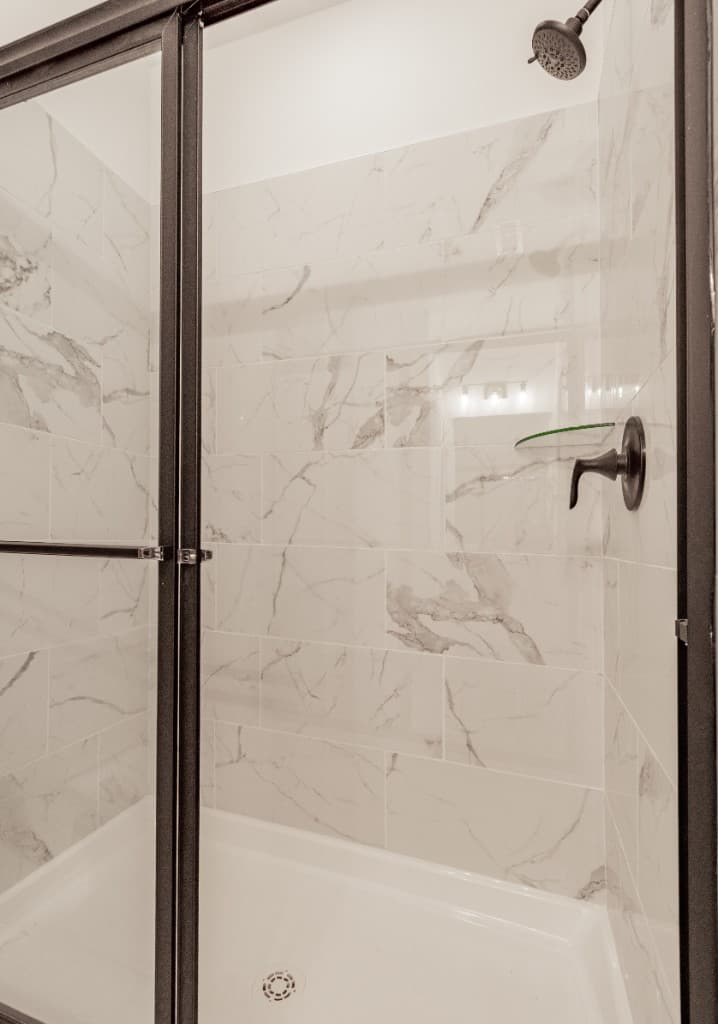 Deans Row Avenue — walk-in shower with marble tile